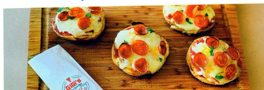 Pepperoni pizza bagels on a wooden board